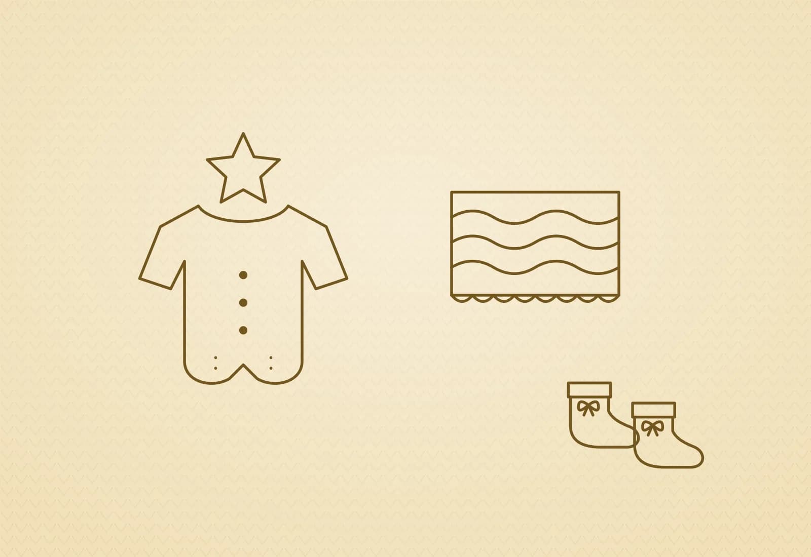 A mustard star romper folded beside a wavy striped blanket
